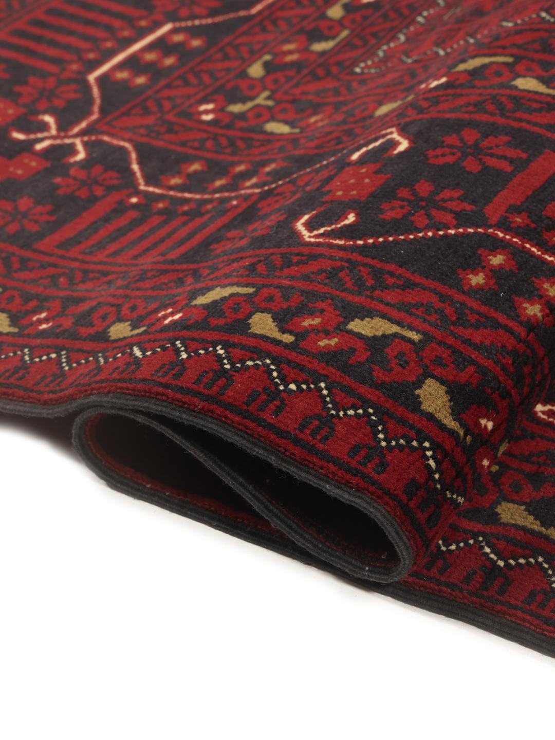 Hand-knotted Afghan Kunduz rug with red and black geometric patterns