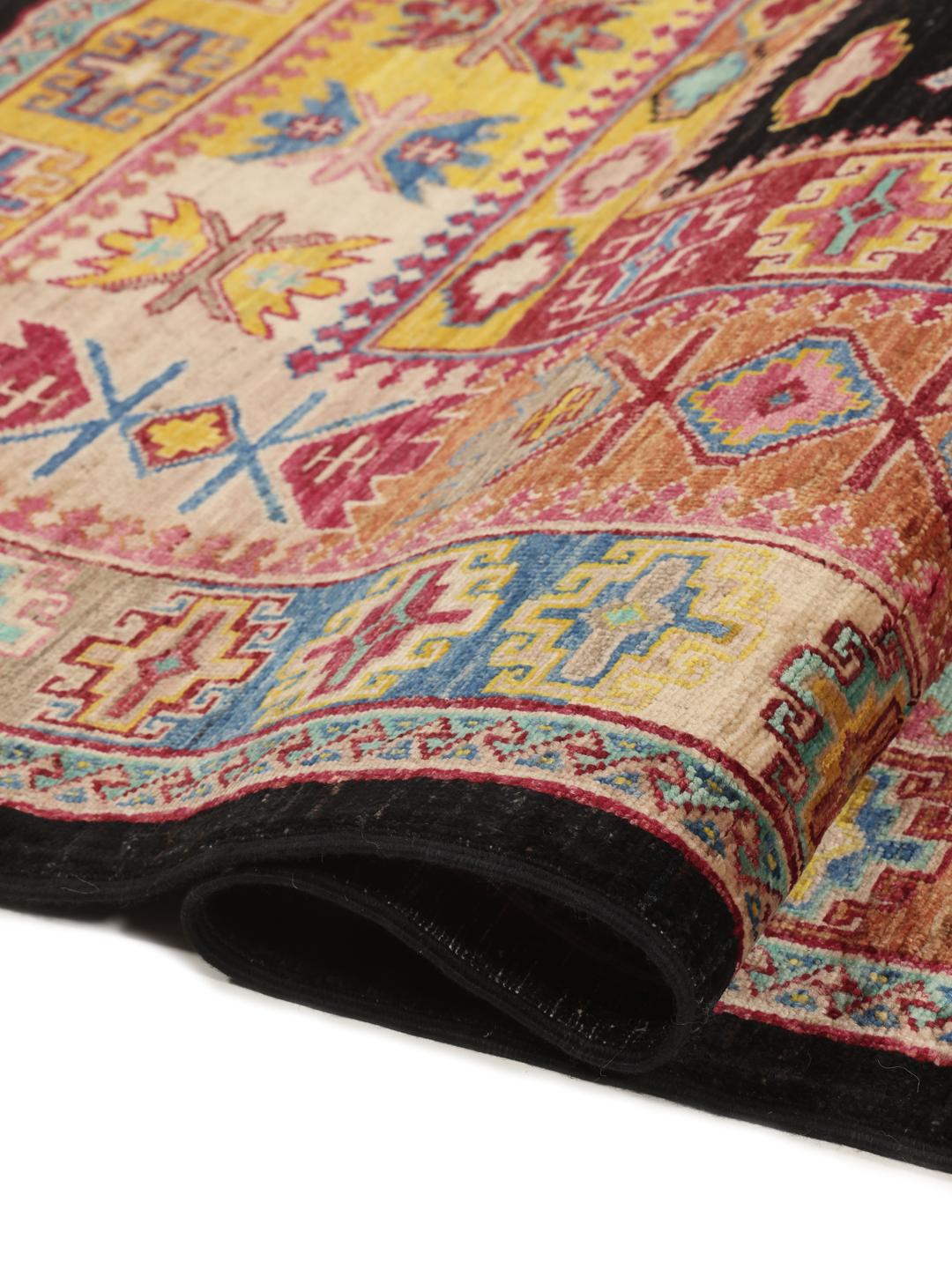 Hand-knotted Afghan rug with a black field and multicoloured diamond patterns.