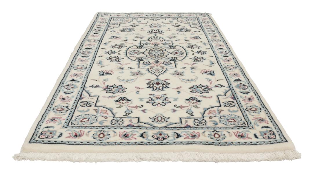 A hand-knotted Nain 9La rug from the Middle East in beige, blue, and pink colours.