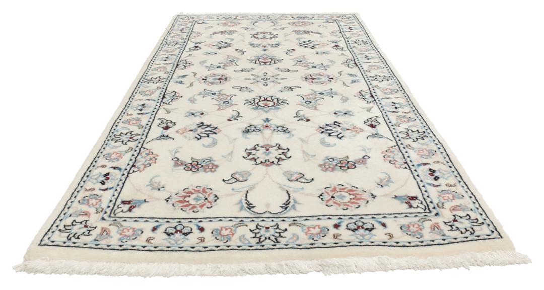 Hand knotted Nain 9La rug with delicate floral motifs on a cream background