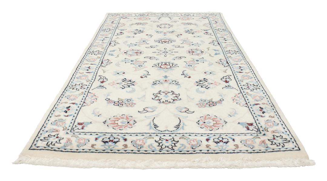 Hand knotted Nain 9La rug with delicate floral motifs on a cream background