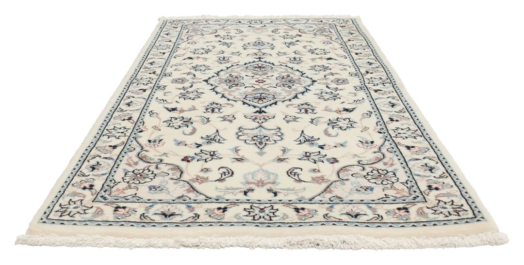 Hand-knotted Nain 9La rug from the Middle East in beige with intricate floral patterns