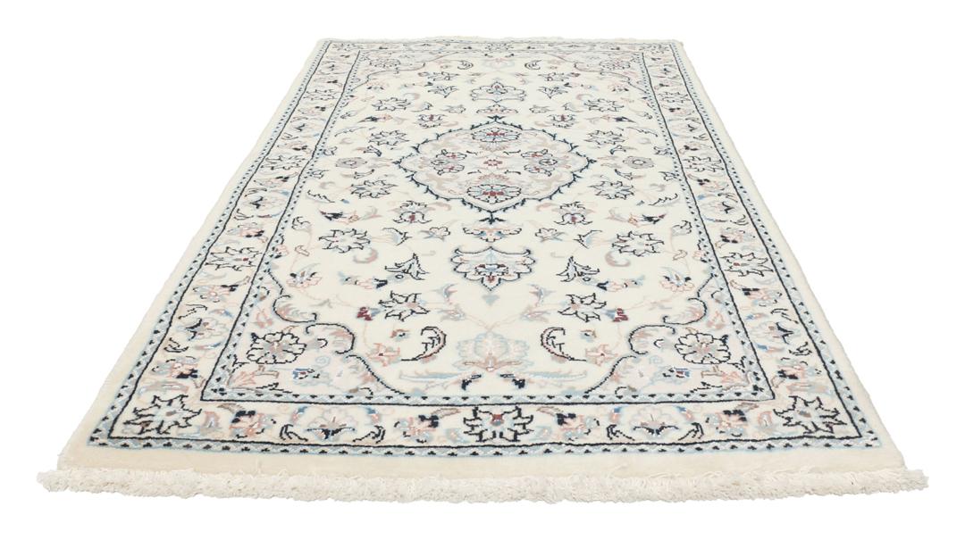 Hand-knotted Nain 9La rug from the Middle East in beige with intricate floral patterns