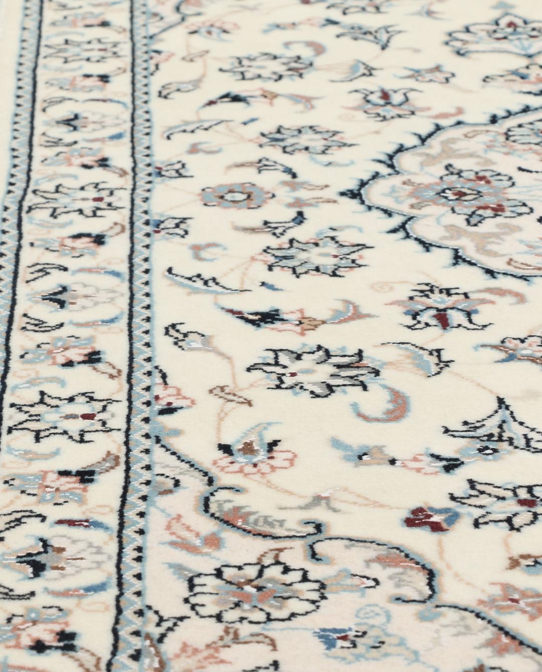 Hand-knotted Nain 9La rug from the Middle East in beige with intricate floral patterns