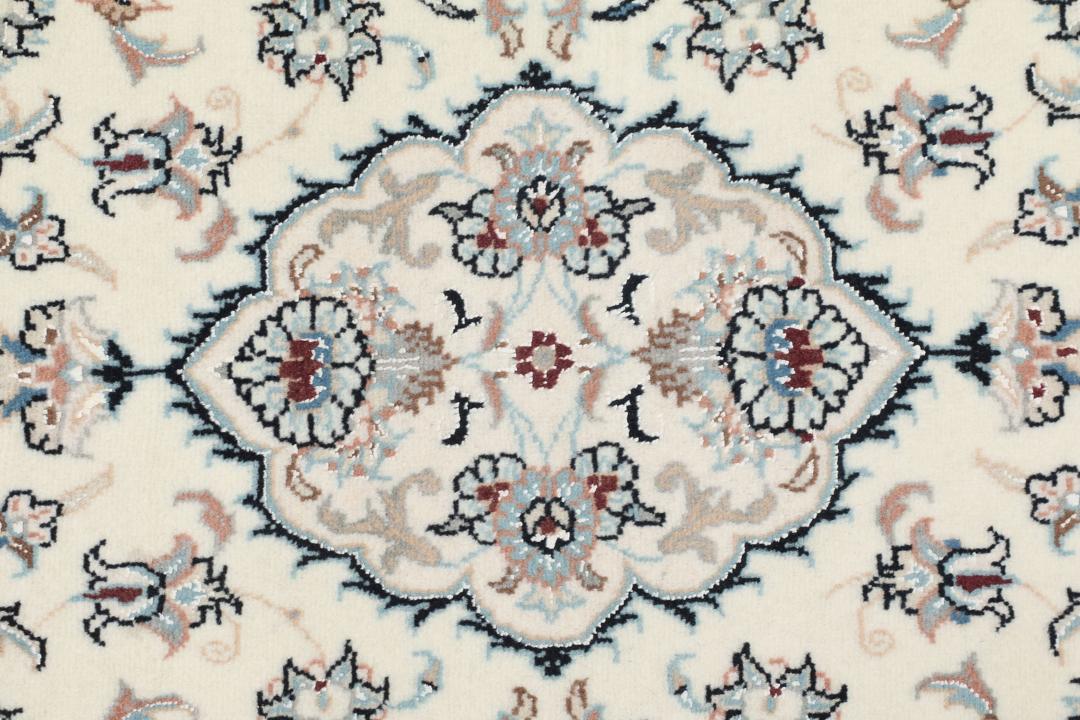 Hand-knotted Nain 9La rug from the Middle East in beige with intricate floral patterns