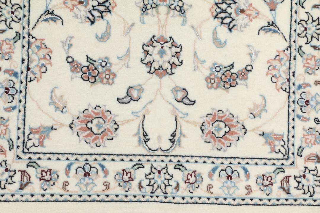 Hand-knotted Nain 9La rug from the Middle East in beige with intricate floral patterns