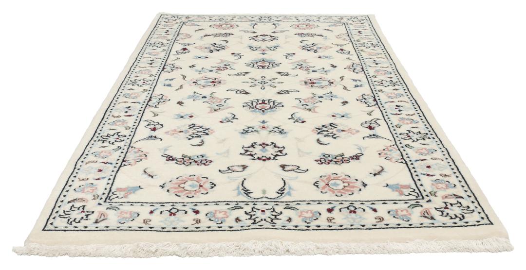 A rectangular Nain 9La rug from the Middle East with a beige background and floral motifs