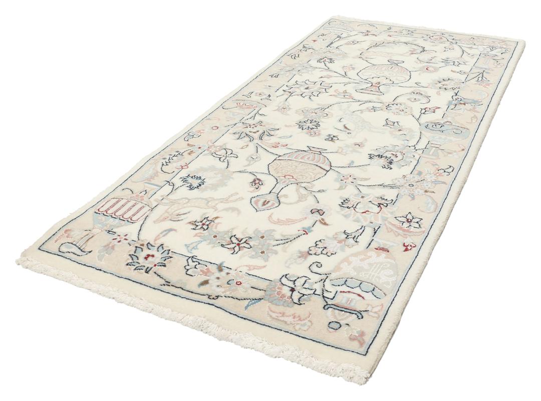 Hand-knotted Nain 9La rug from the Middle East in a soft beige colour with floral patterns