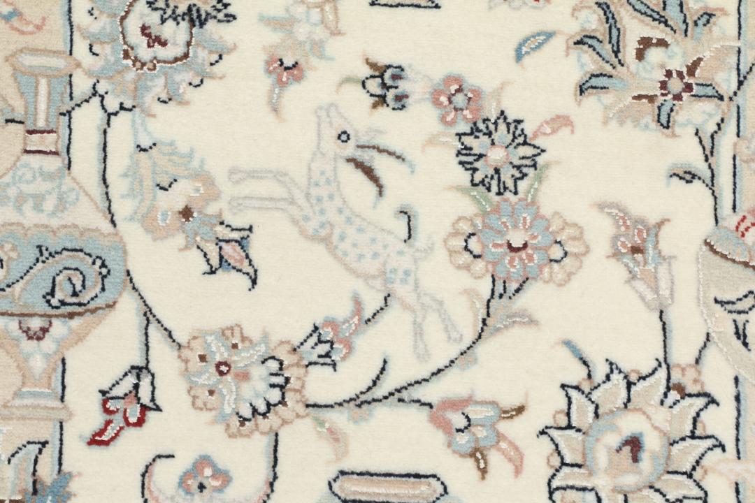 Hand-knotted Nain 9La rug from the Middle East in a soft beige colour with floral patterns