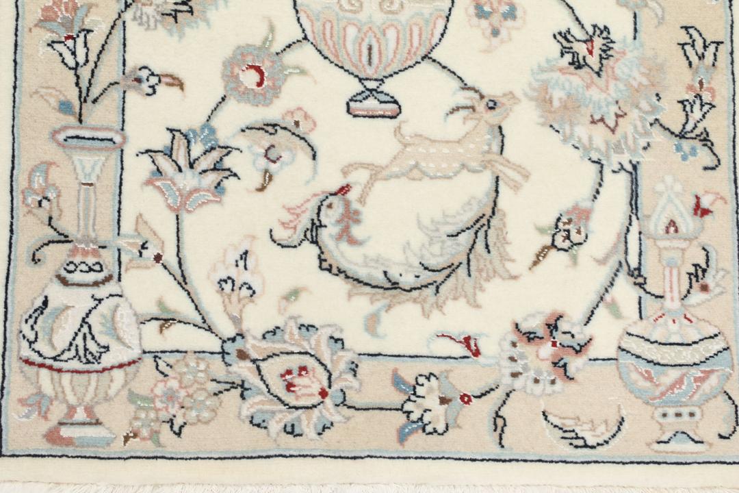 Hand-knotted Nain 9La rug from the Middle East in a soft beige colour with floral patterns