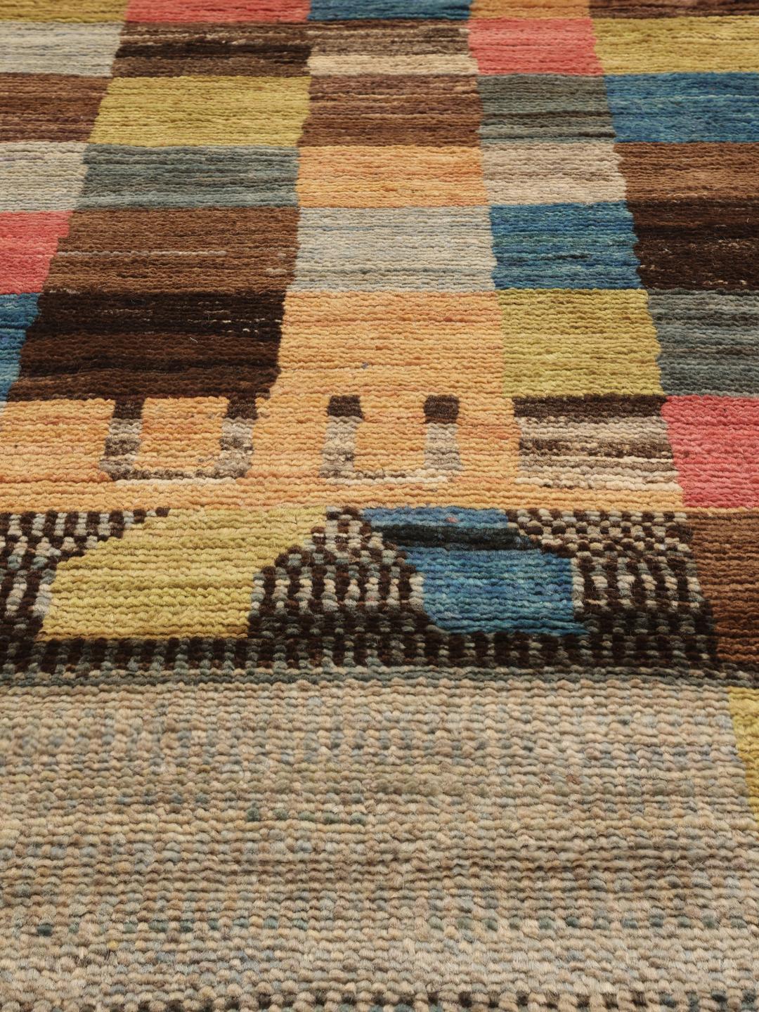 Hand-knotted Middle Eastern rug with a colourful patchwork design in multicolours