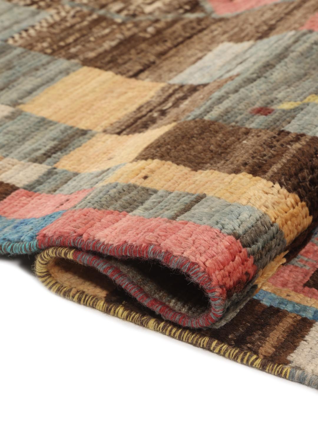 Hand-knotted Middle Eastern rug with a colourful patchwork design in multicolours