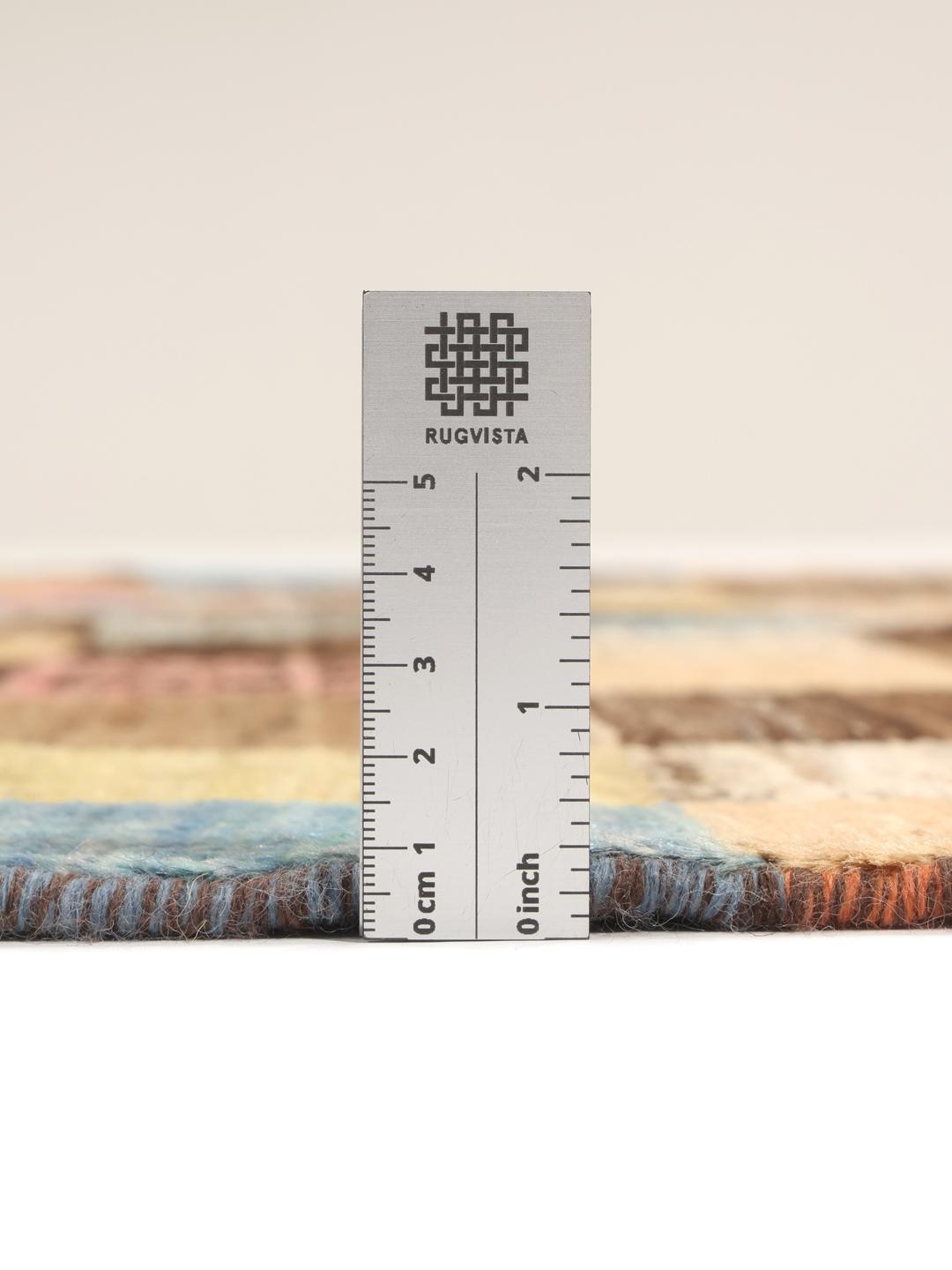 Hand-knotted Middle Eastern rug with a colourful patchwork design in multicolours