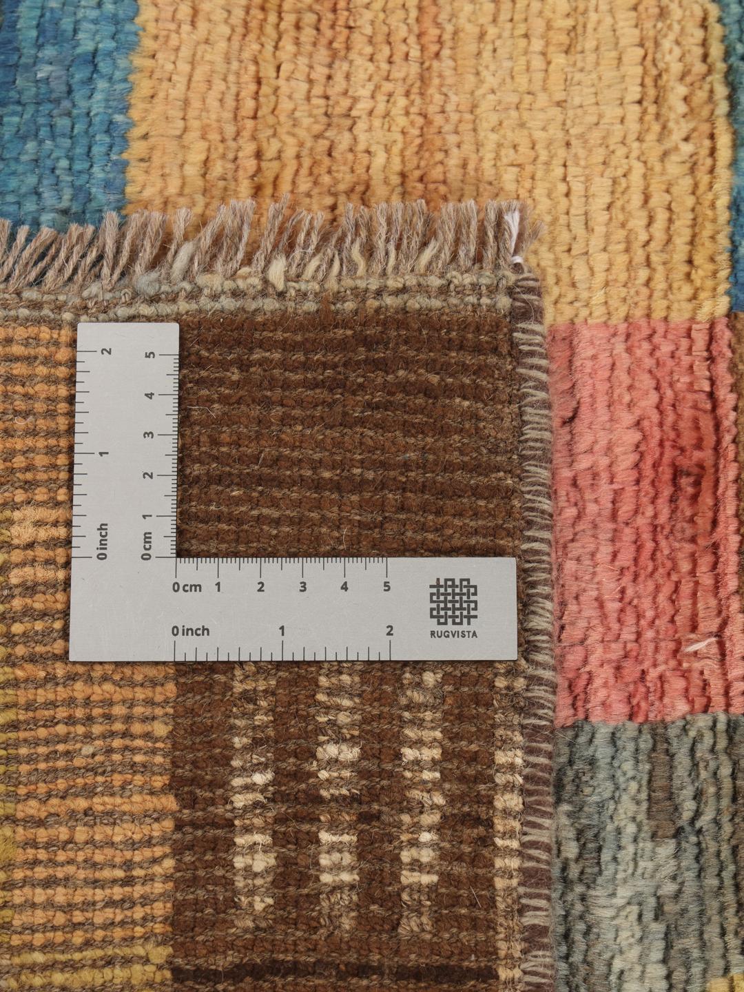 Hand-knotted Middle Eastern rug with a colourful patchwork design in multicolours