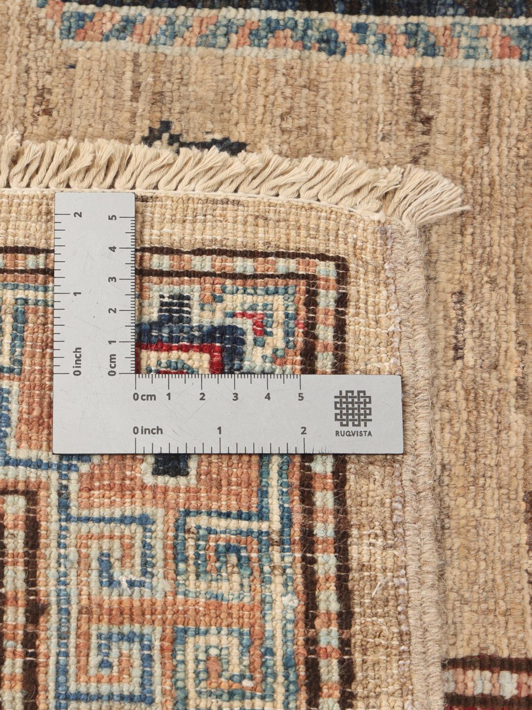 Hand-knotted Kazak rug from Afghanistan with a geometric pattern in beige, red, and blue