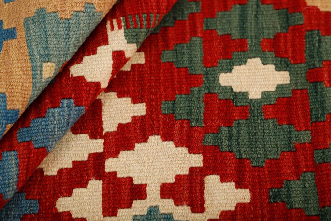 Hand-woven Kilim rug from the Middle East with geometric patterns in multicolor Wool.