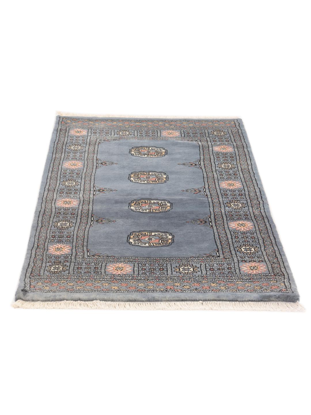 Hand-knotted blue Pakistan Bokhara rug with traditional medallion patterns