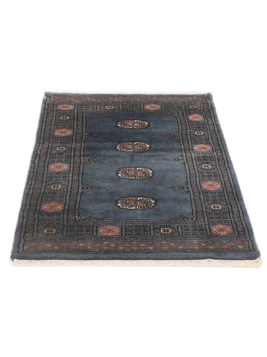 Hand-knotted blue Pakistan Bokhara rug with traditional medallion patterns