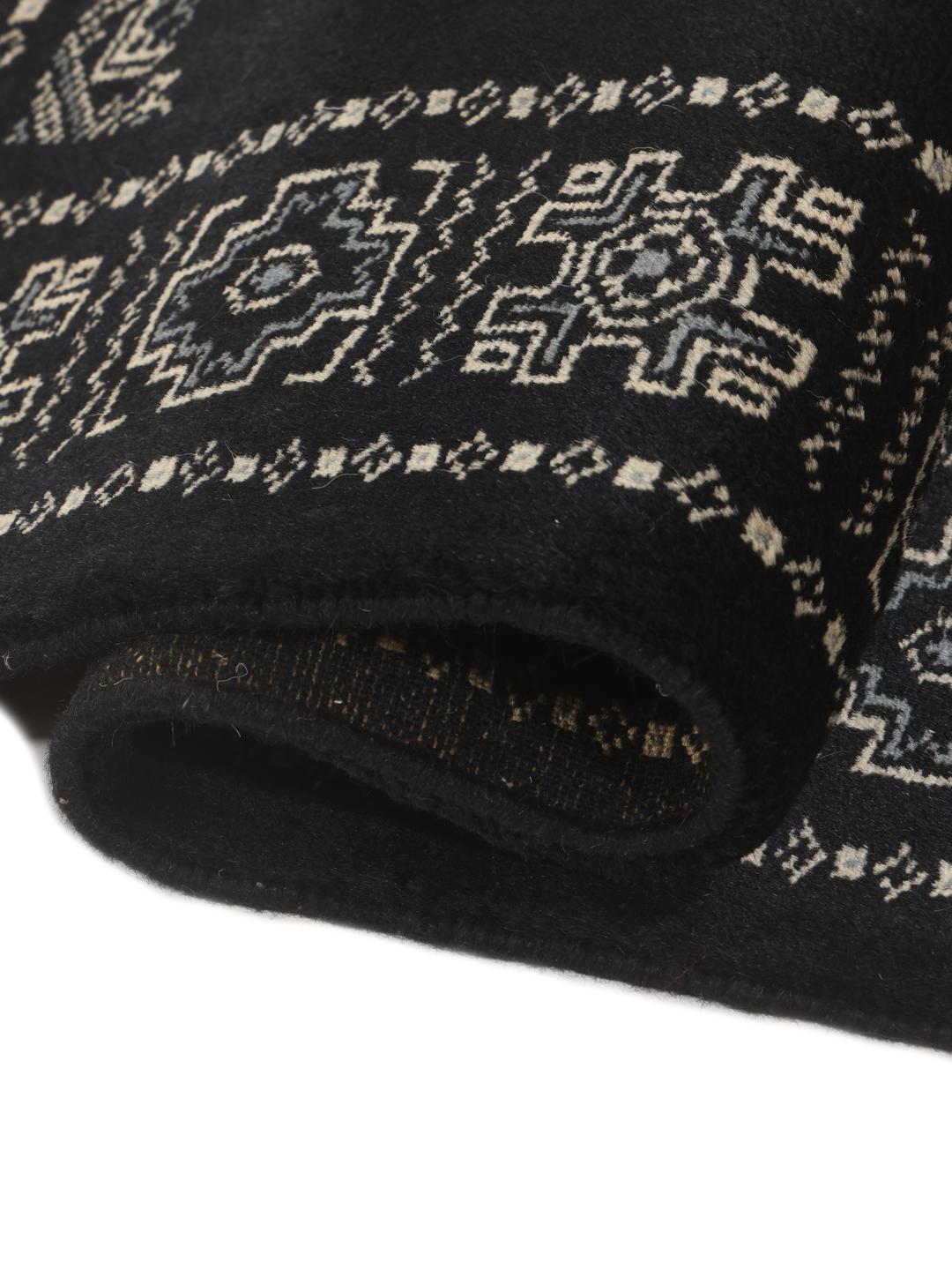 Hand-knotted Pakistan Bokhara rug in black with traditional geometric motifs