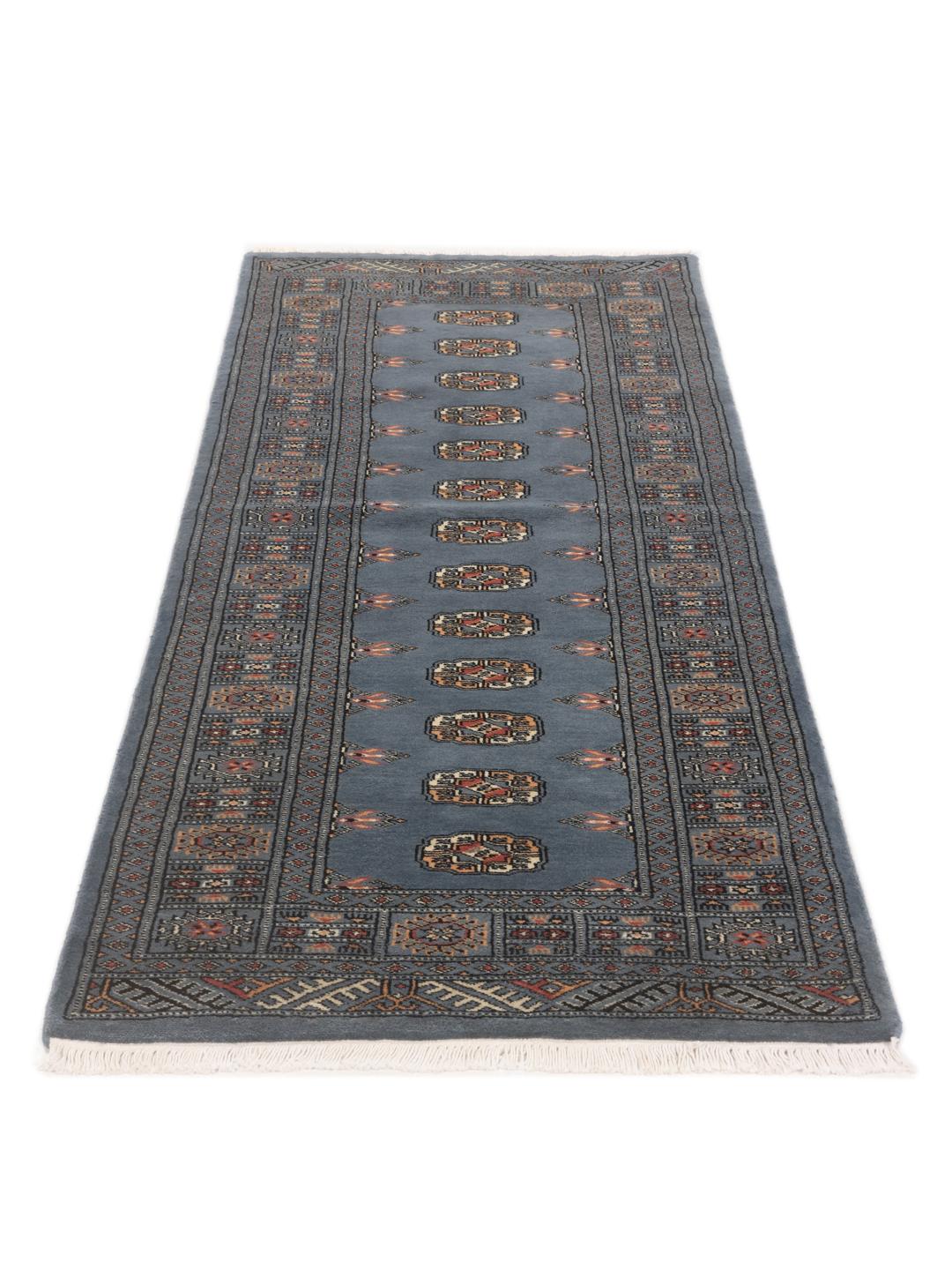 Hand-knotted Pakistan Bokhara runner rug in blue with traditional geometric motifs