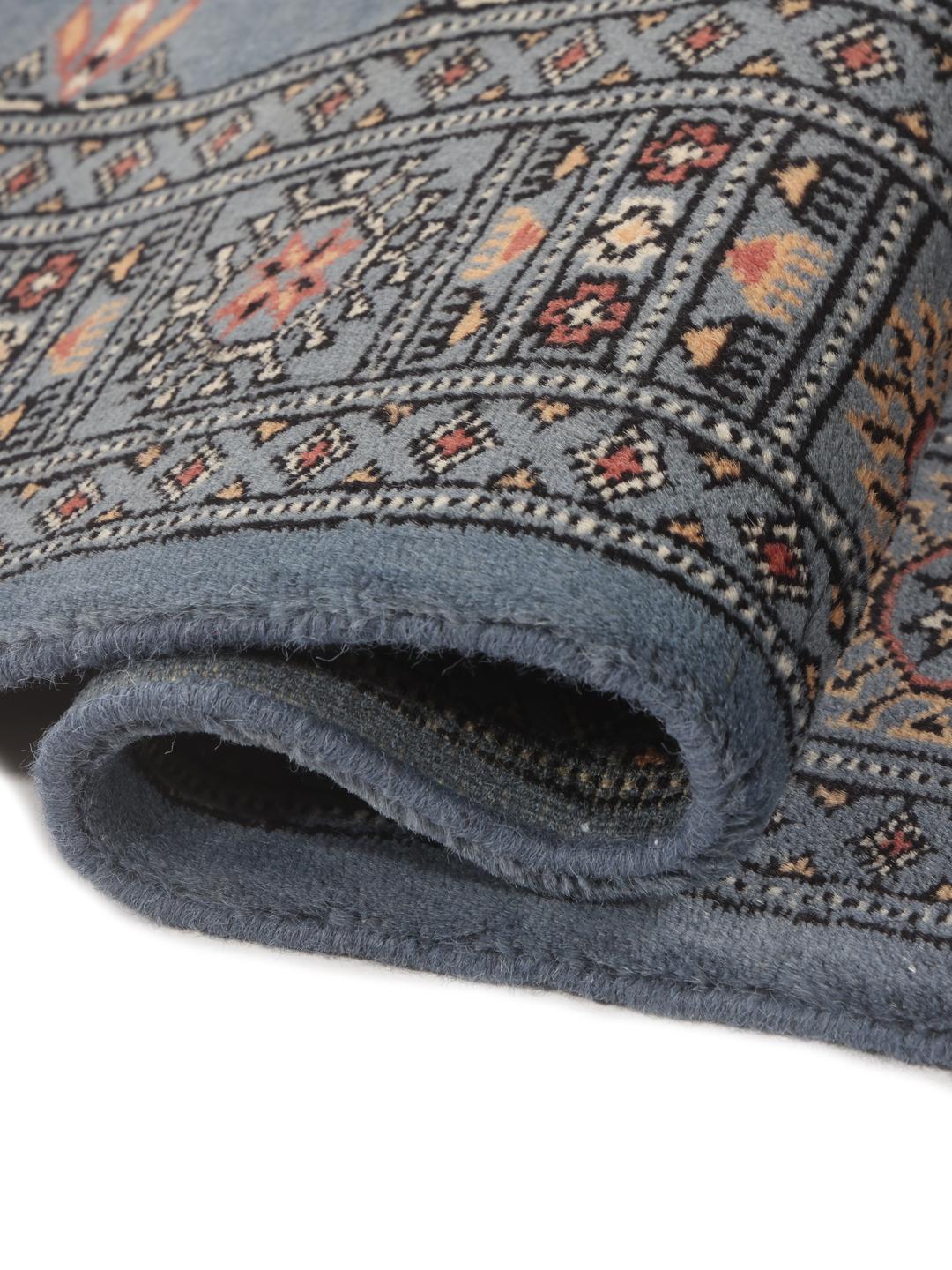 Hand-knotted Pakistan Bokhara runner rug in blue with traditional geometric motifs