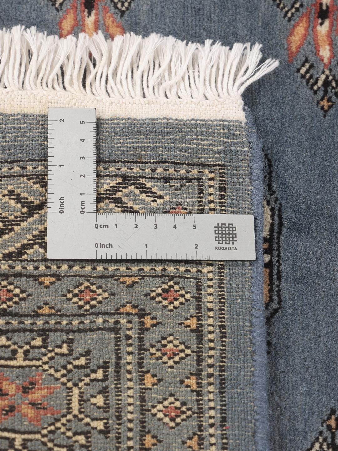 Hand-knotted Pakistan Bokhara runner rug in blue with traditional geometric motifs