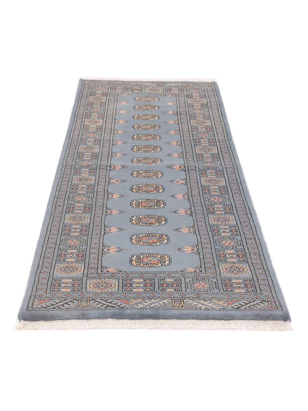 Hand-knotted Pakistan Bokhara runner rug in blue with traditional geometric motifs
