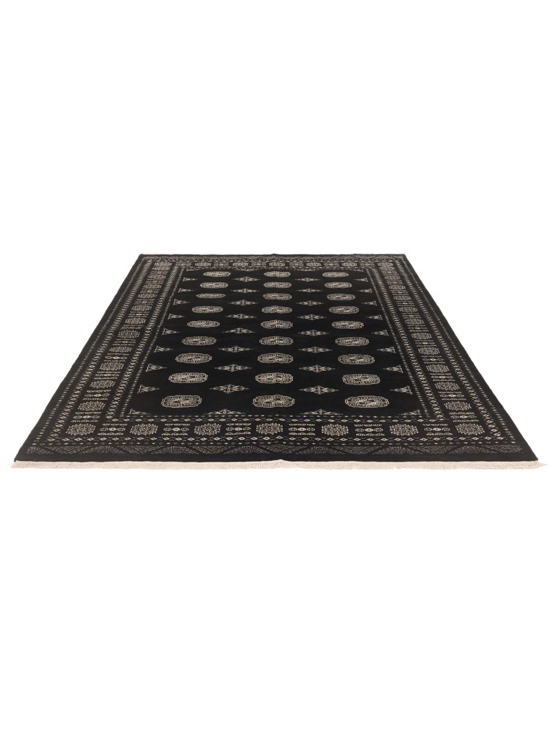 A hand-knotted black Pakistan Bokhara rug with traditional geometric motifs.