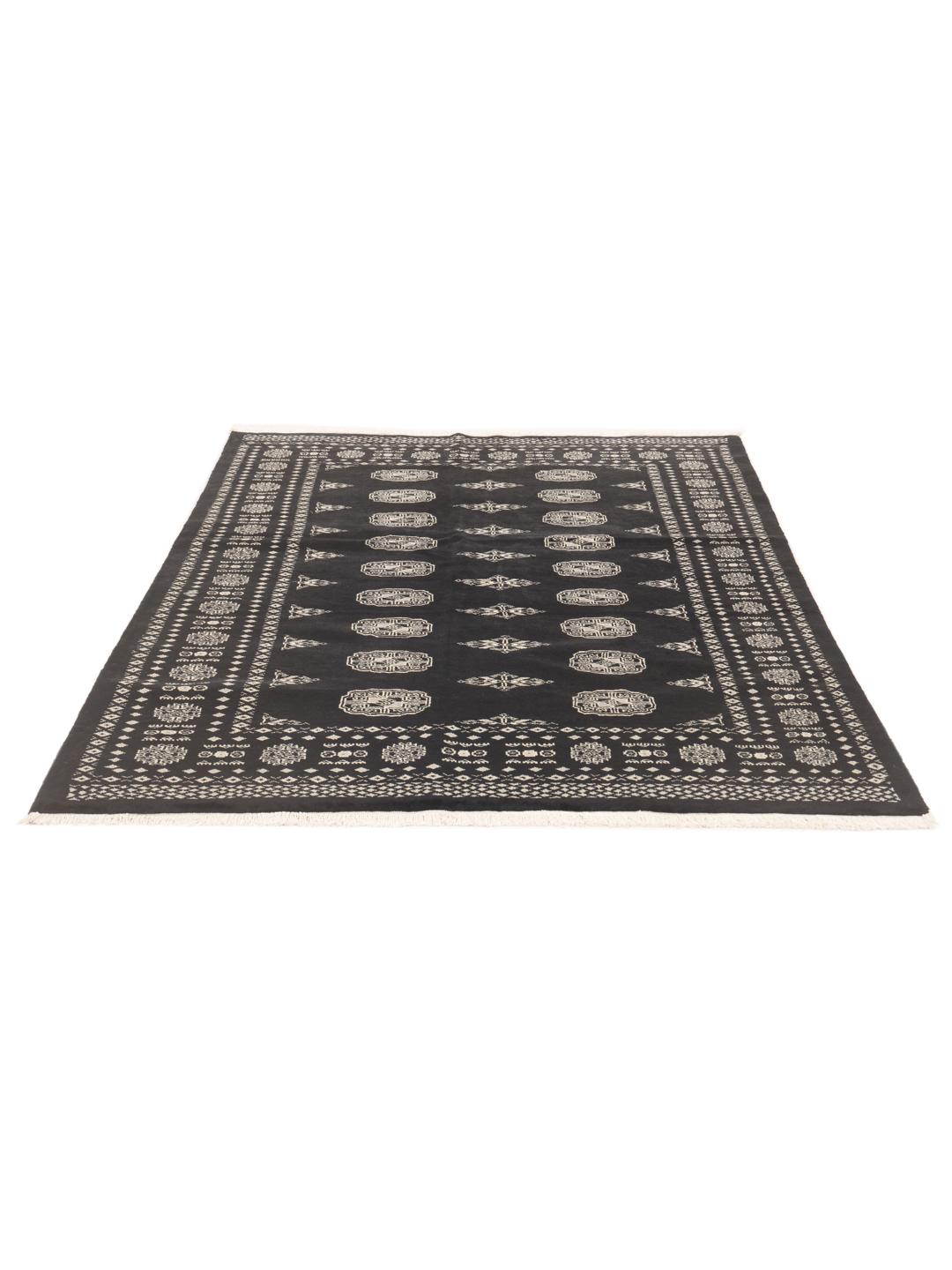A hand-knotted Pakistan Bokhara rug in black with detailed geometric motifs.