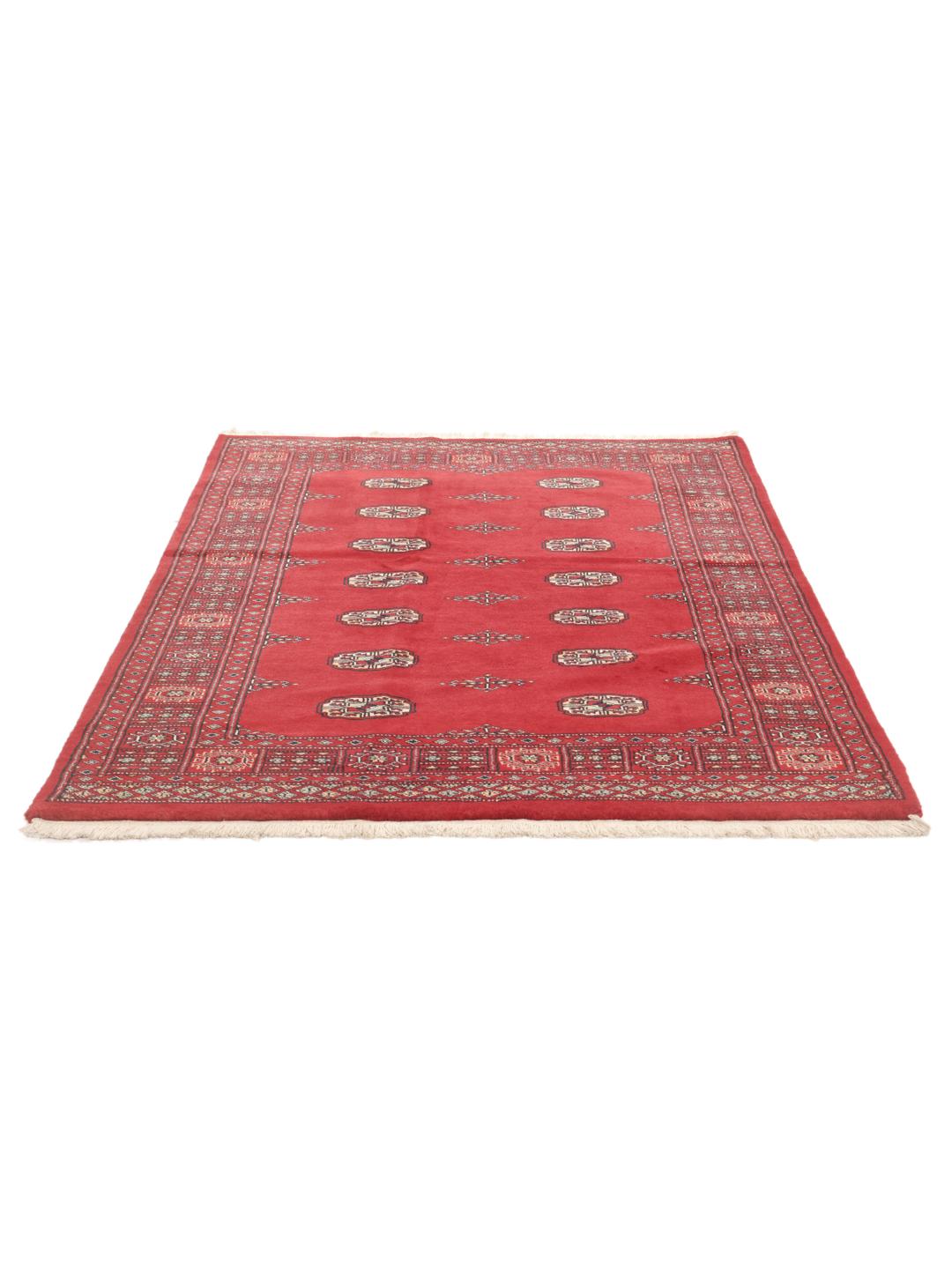 Hand-knotted Pakistan Bokhara rug in a deep red color with traditional motifs.