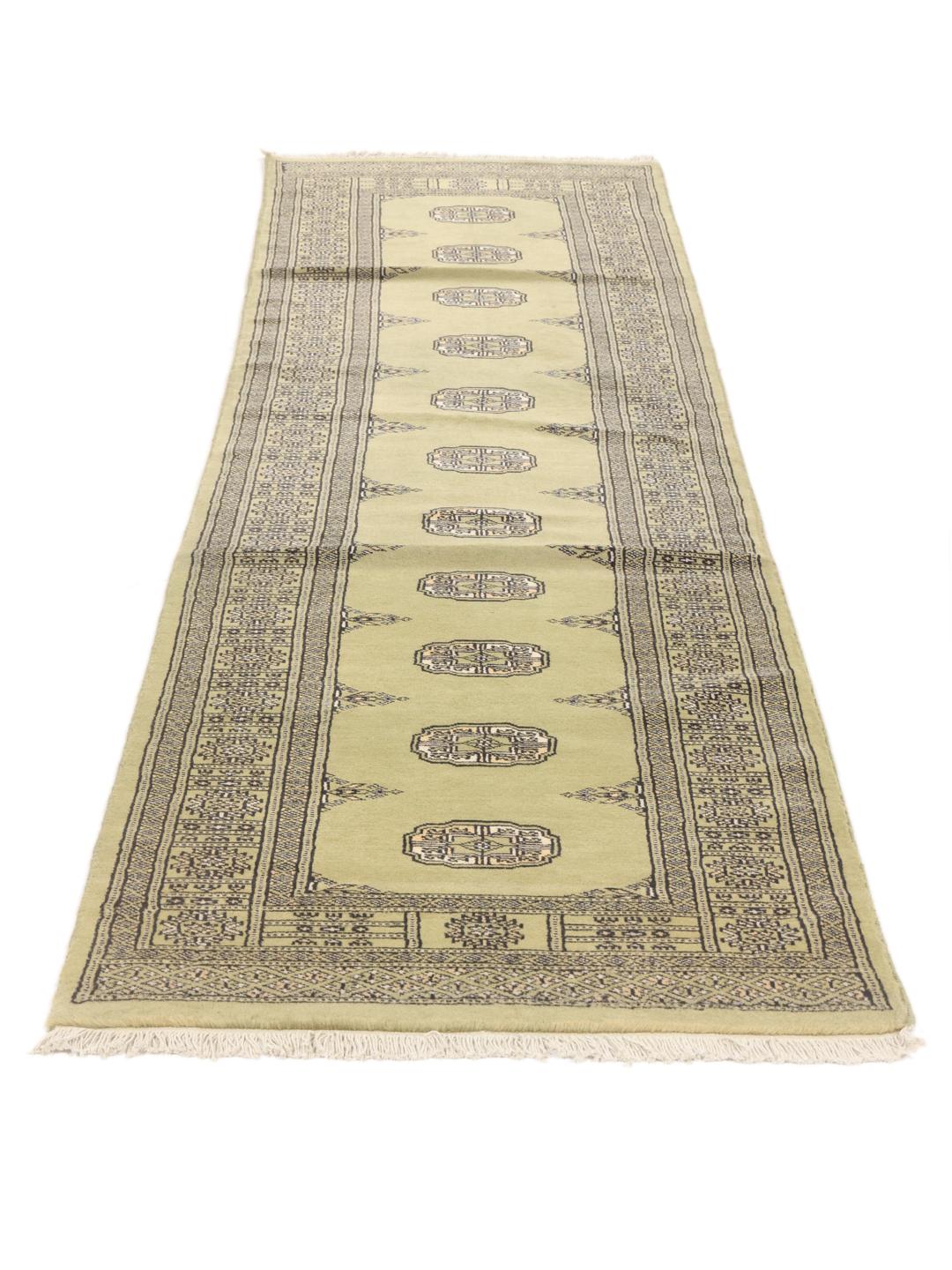 Hand-knotted Pakistani runner rug in light green with geometric patterns