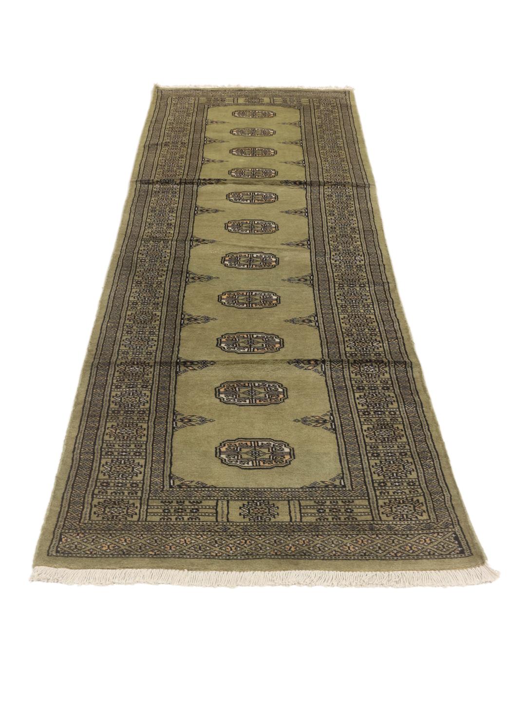 Hand-knotted Pakistani runner rug in light green with geometric patterns