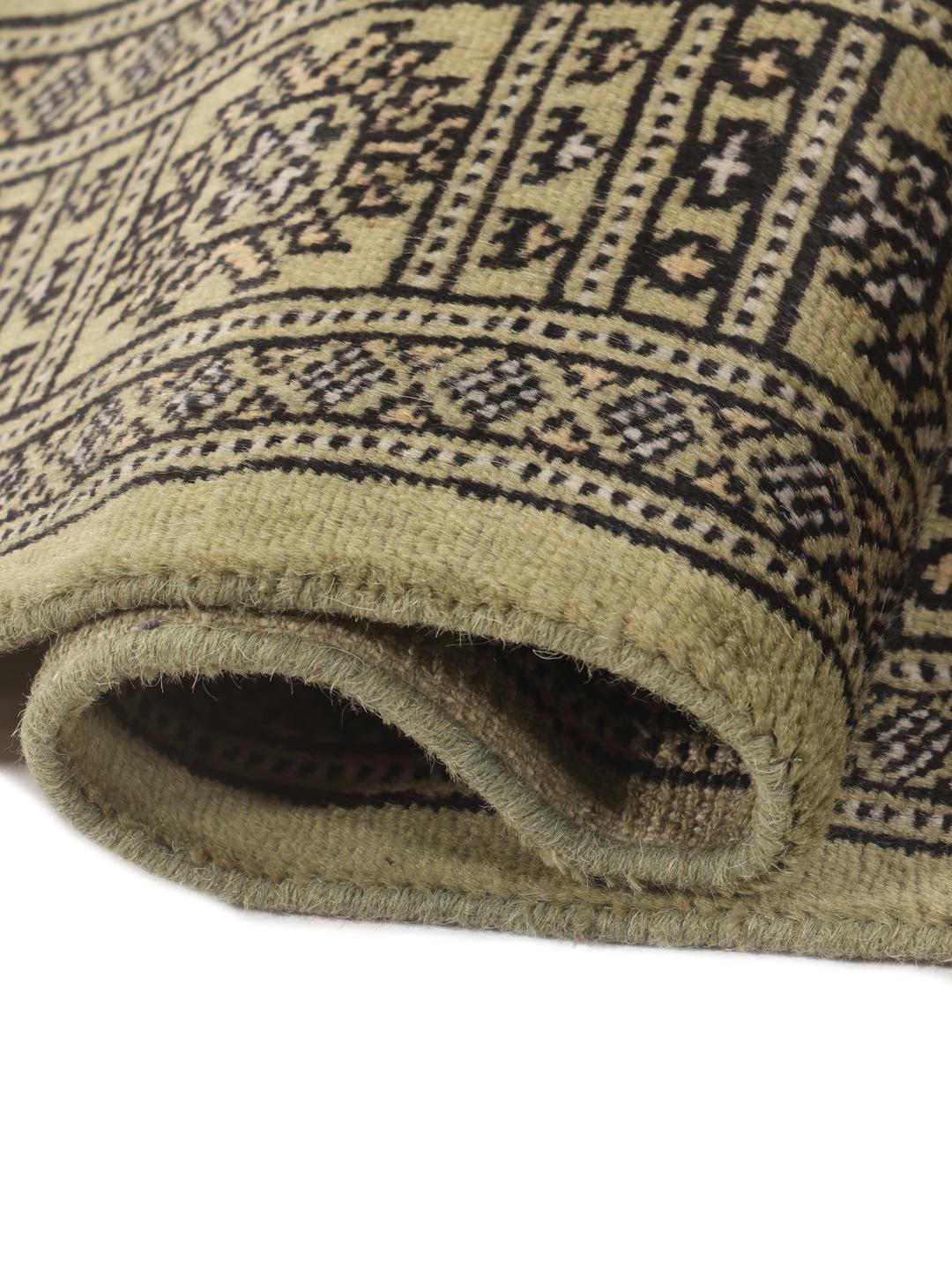Hand-knotted Pakistani runner rug in light green with geometric patterns