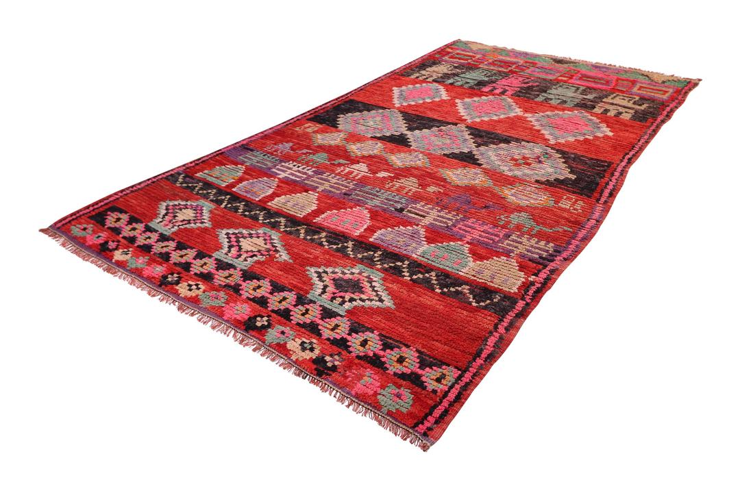 Marokkanischer Vintage-Teppich mit lebendigen, mehrfarbigen Stammesmotiven und Wollflor