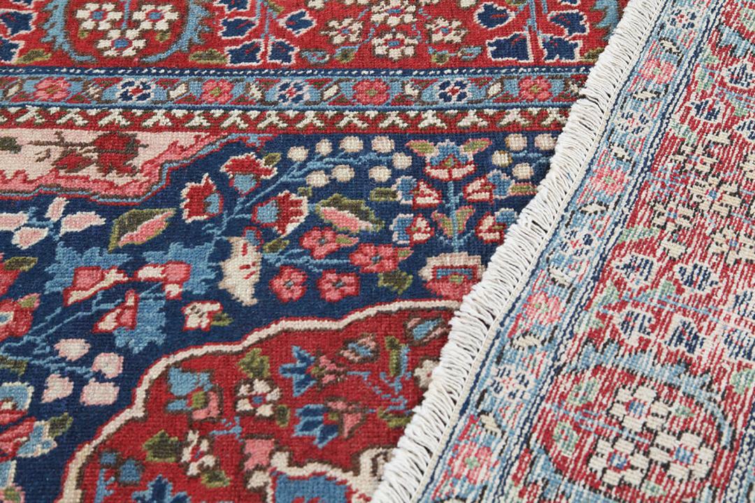 Tabriz tæppe med oprindelse i Mellemøsten i rød