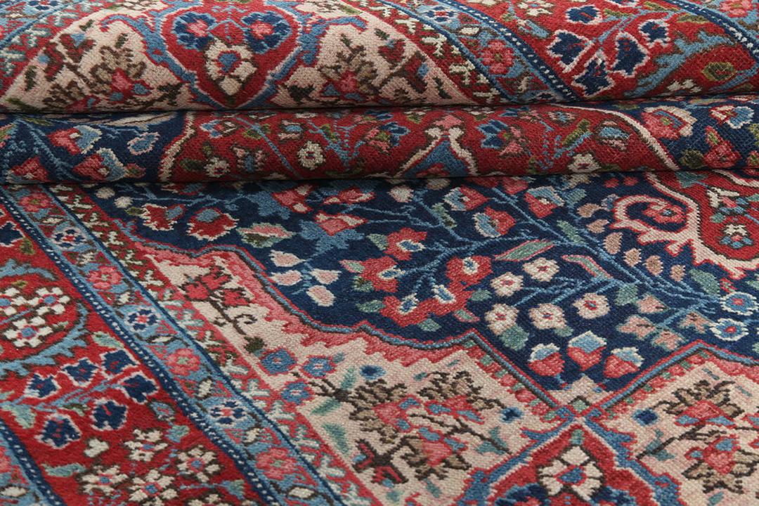 Tabriz tæppe med oprindelse i Mellemøsten i rød
