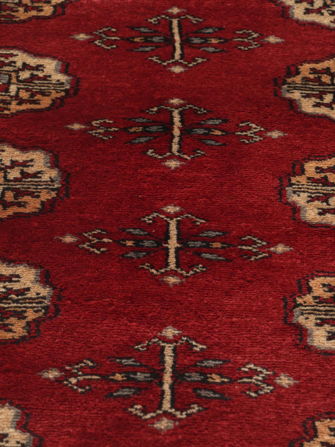 Hand-knotted Pakistan Bokhara 3ply rug in dark-red with repeating medallion motifs
