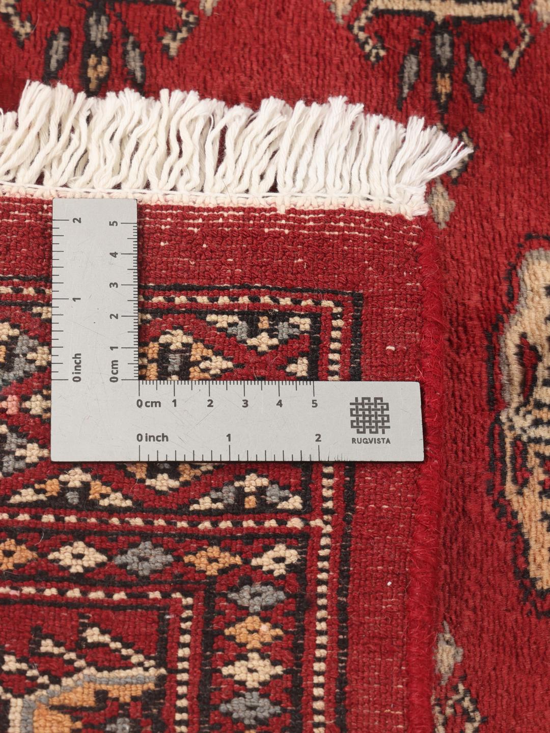 Hand-knotted Pakistan Bokhara 3ply rug in dark-red with repeating medallion motifs