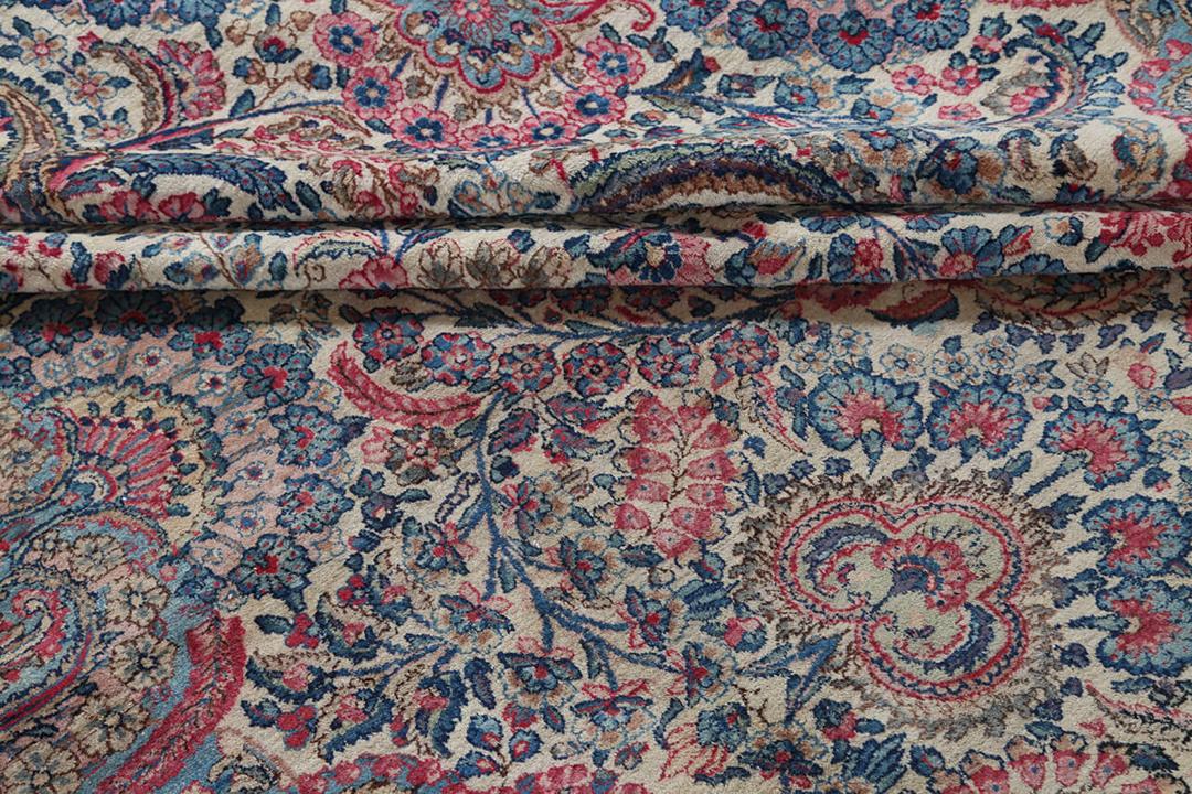 Handmade rug from Persia in beige and dark-red