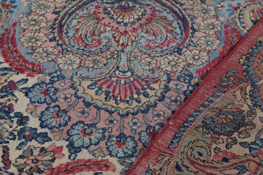 Handmade rug from Persia in beige and dark-red