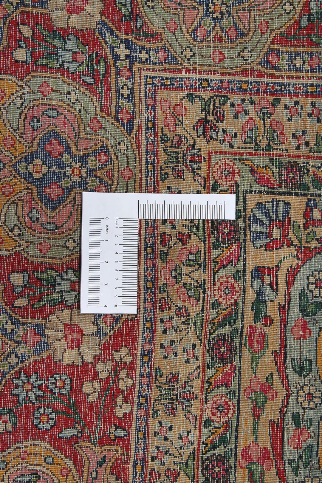 Handgeknoopt tapijt uit het Midden-Oosten in rood en blauw met bloemenmedaillonpatroon