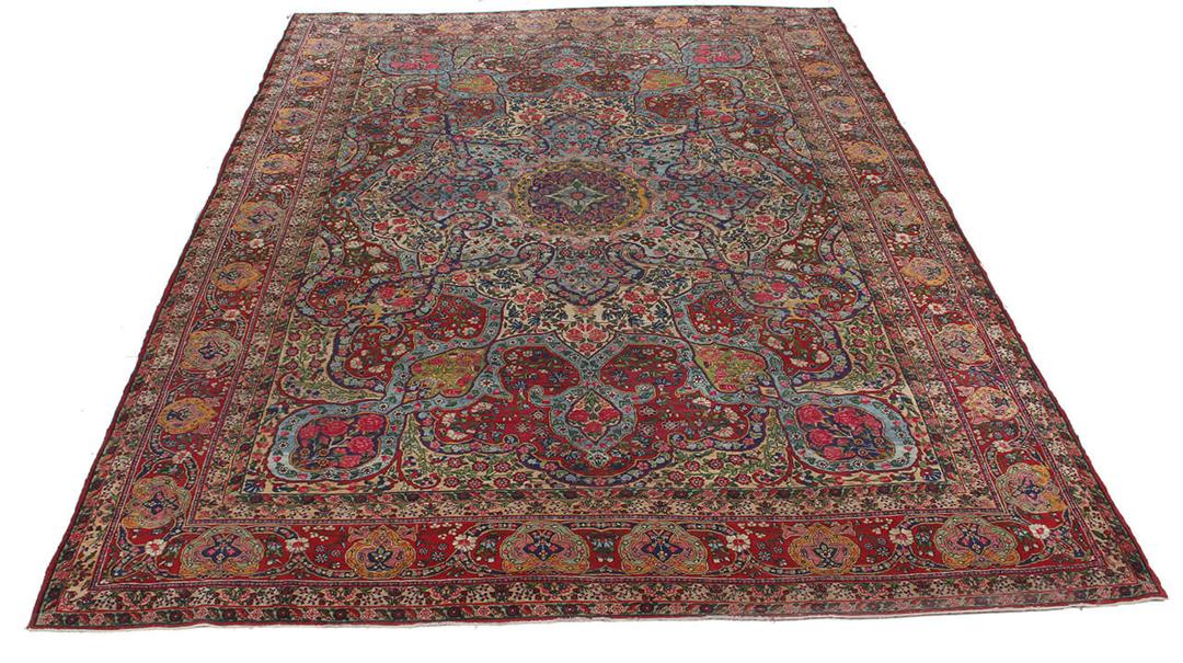 Handgeknoopt tapijt uit het Midden-Oosten in rood en blauw met bloemenmedaillonpatroon
