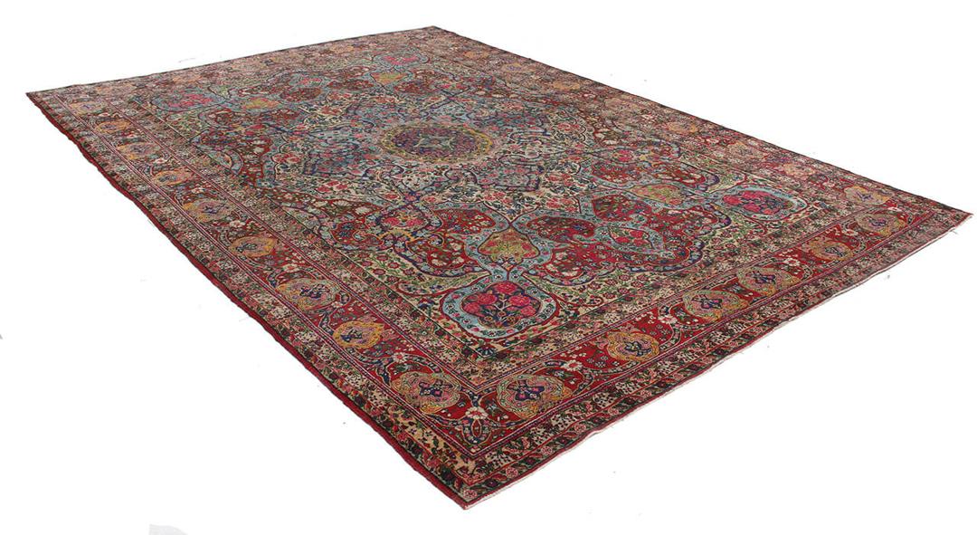Handgeknoopt tapijt uit het Midden-Oosten in rood en blauw met bloemenmedaillonpatroon