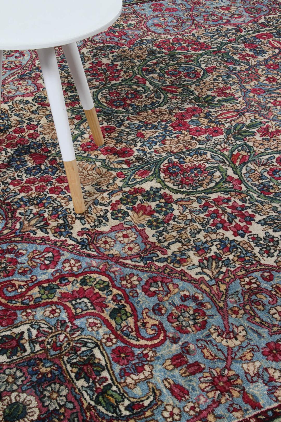 Håndlavet Kerman tæppe med røde og blå toner fra Persien