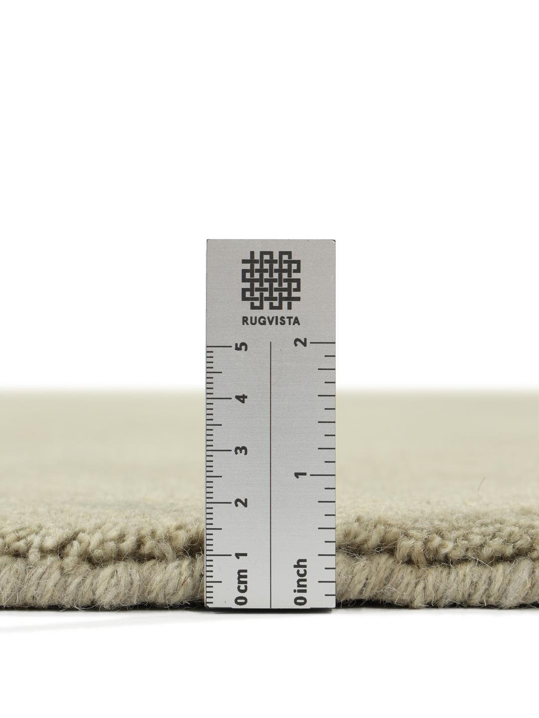 Round light green rug with a soft pile texture