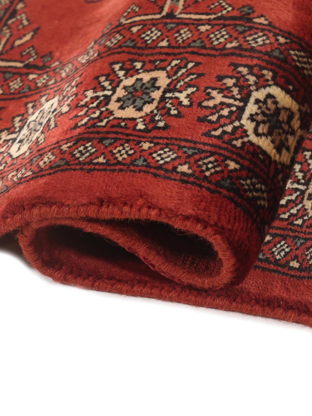 Hand-knotted Pakistan Bokhara 3ply rug in red with traditional motifs