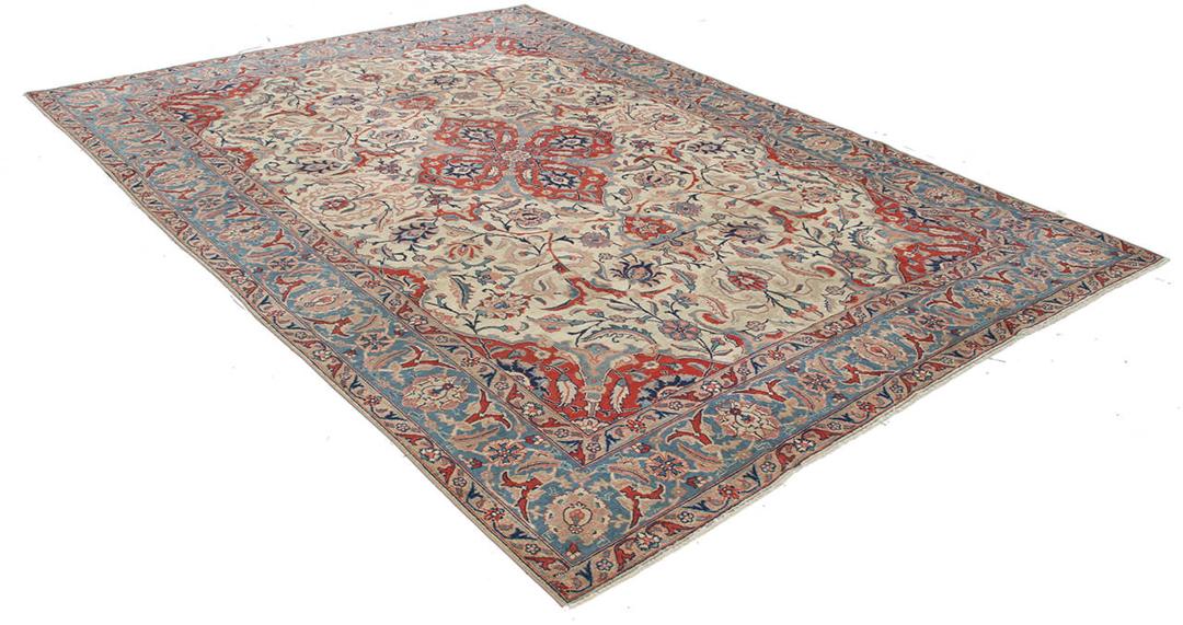Antique Isfahan rug from the Middle East in beige, red, and blue tones