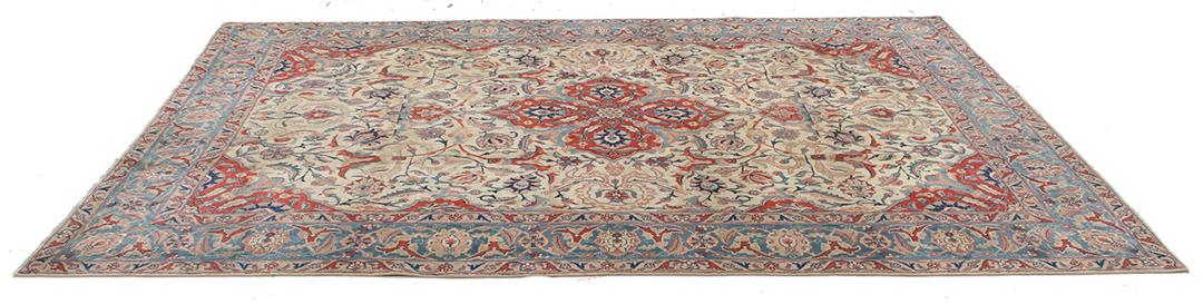 Antique Isfahan rug from the Middle East in beige, red, and blue tones