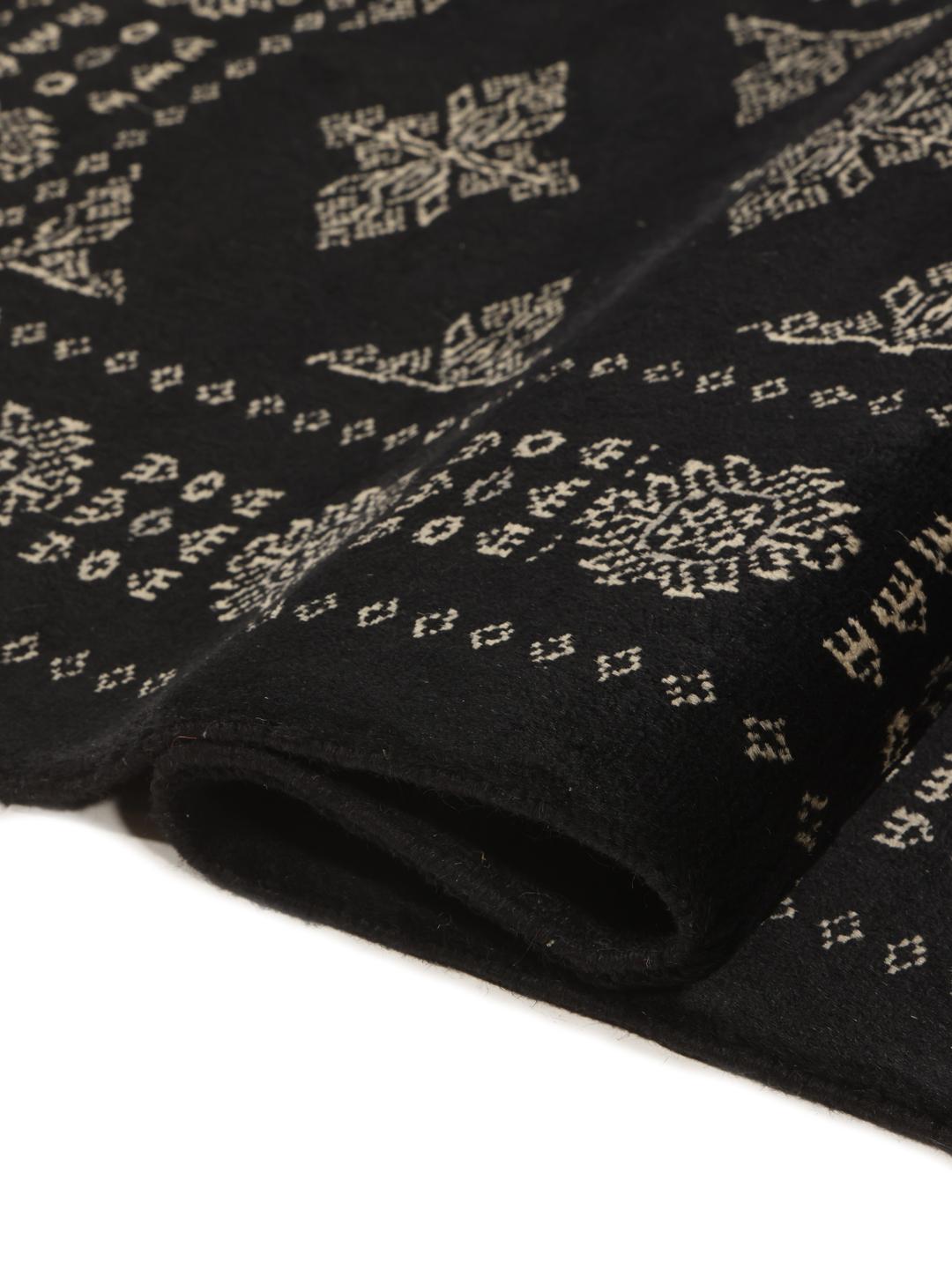 Hand-knotted Pakistan Bokhara runner with intricate motifs on a black background