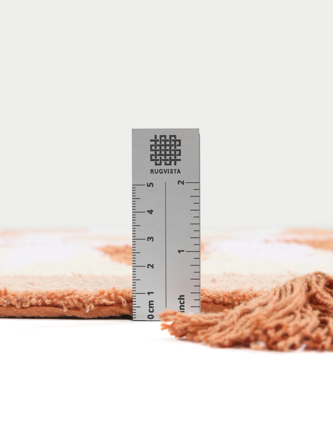 Tapis de bain rond terracotta avec motif étoile et bordure à franges